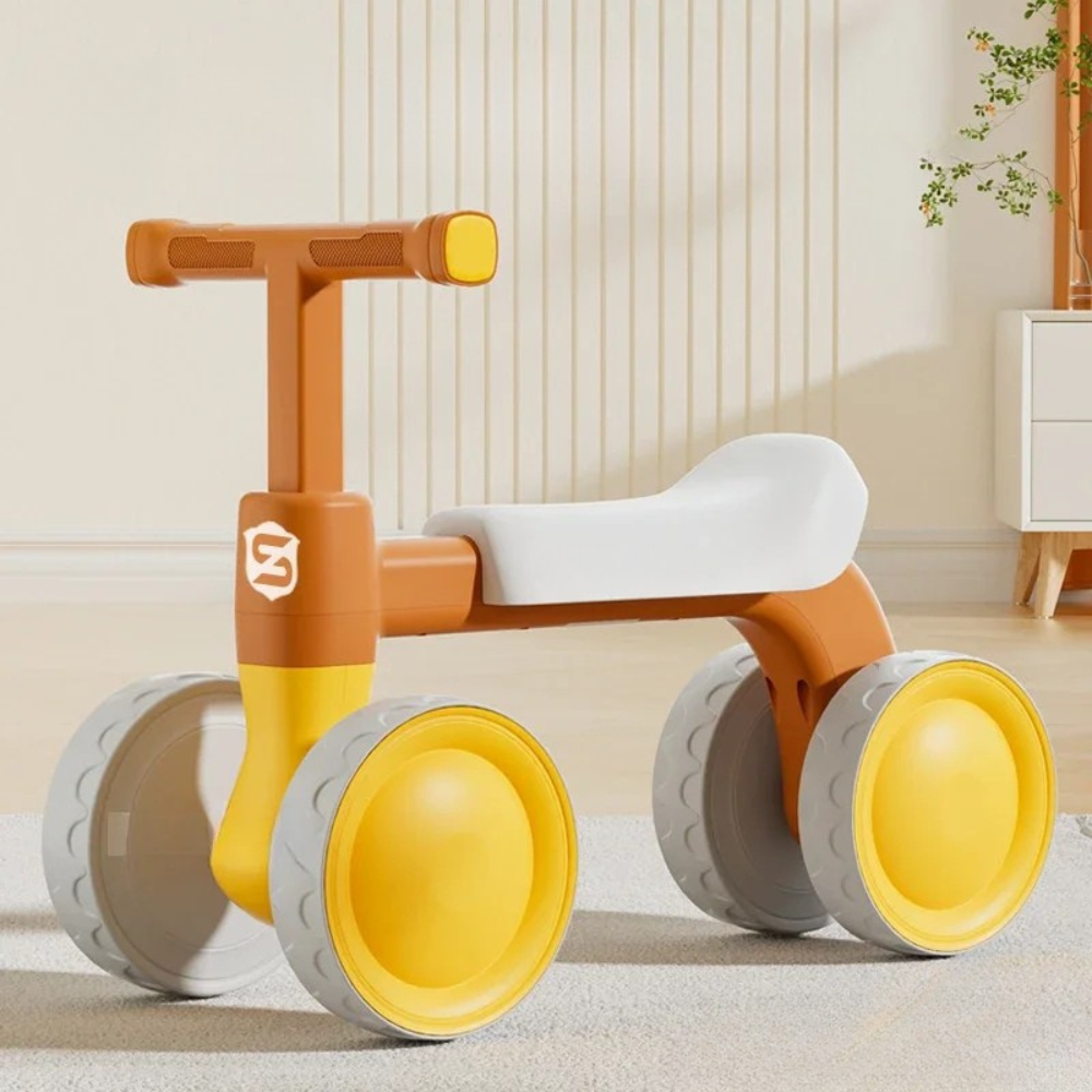 Quadriciclo Infantil Toosly: rodas emborrachadas e silenciosas que protegem o chão, estimulando equilíbrio, confiança e diversão com segurança.